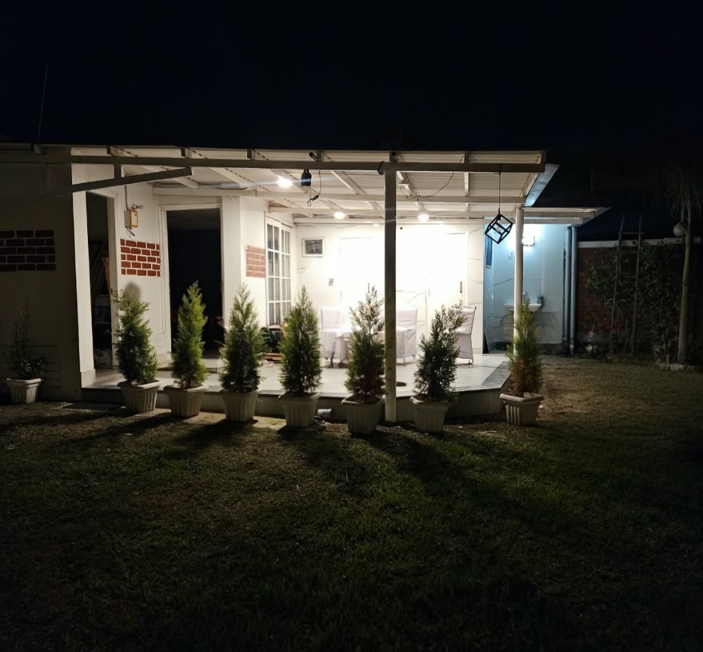 Illuminated night veranda at Oxygen Farms